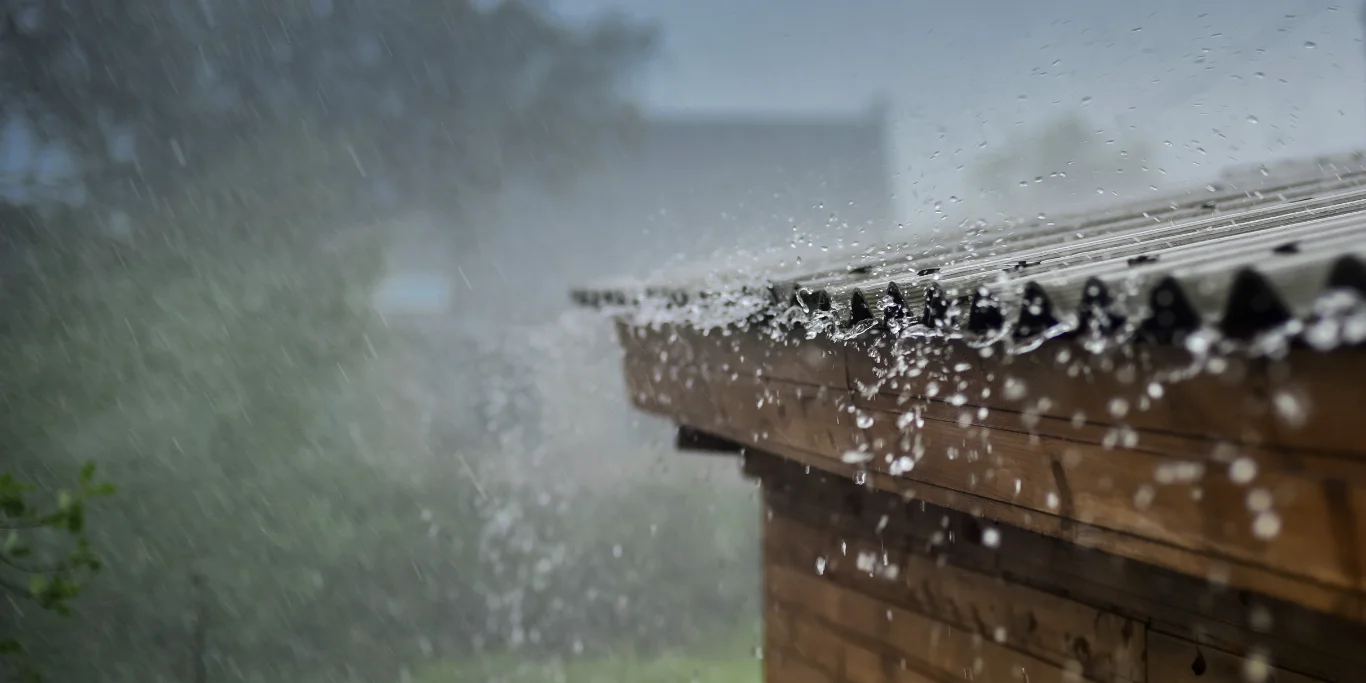 rain flows down from a roof down